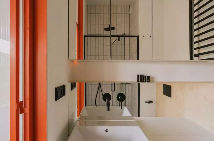 bright bathroom with black accents