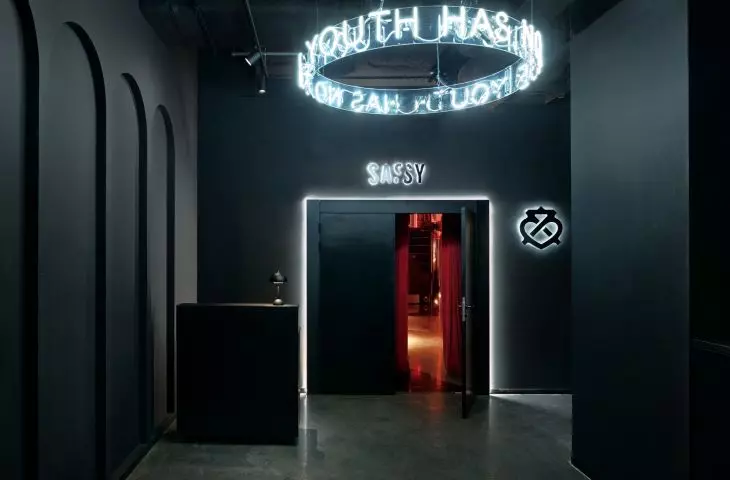 Dark entrance hall with distinctive neon sign