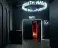 Dark entrance hall with distinctive neon sign