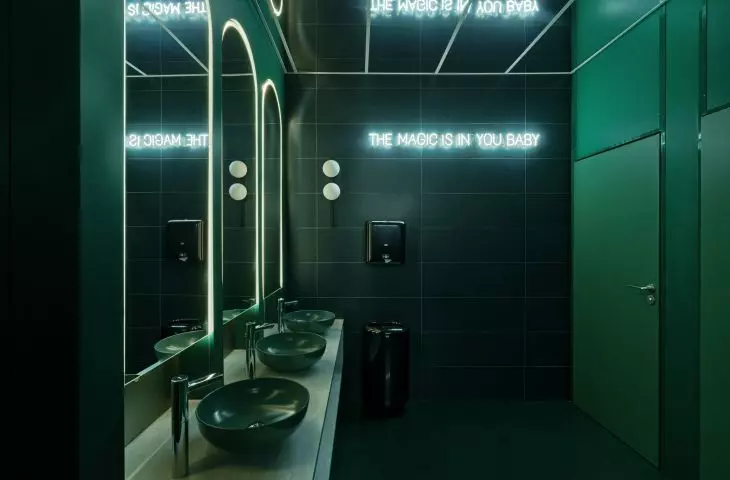 Green bathroom with neon