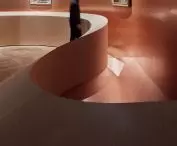 splayed balustrade brings viewers closer to the works on display