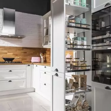 The built-in cabinet is the perfect place for a mini pantry