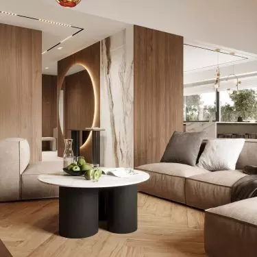 In the corridor there is a large round mirror with striking backlighting