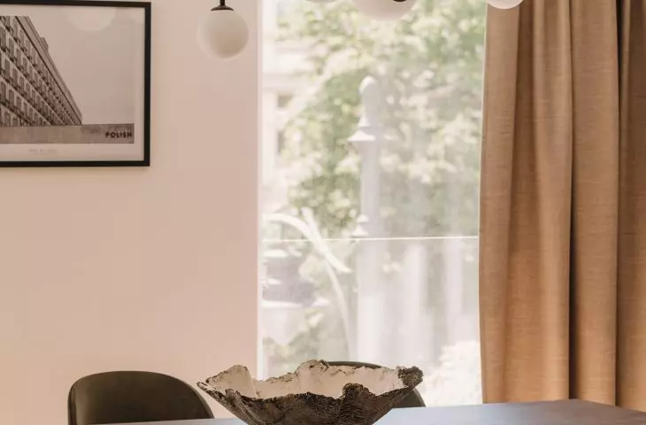 The table is decorated with a ceramic bowl by Jacek Budzowski.