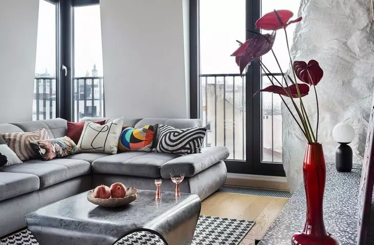 The interior is dominated by a combination of concrete and intense red 