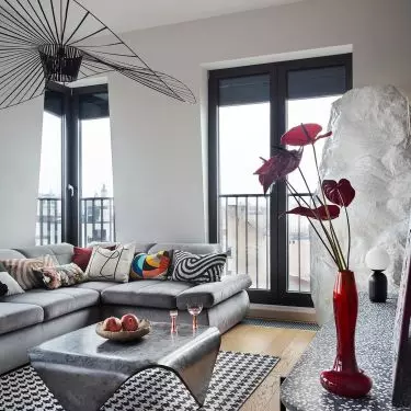 The interior is dominated by a combination of concrete and intense red 