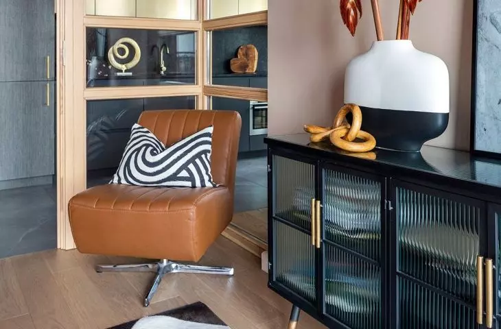 The study is separated by a glass enclosure in a wooden frame