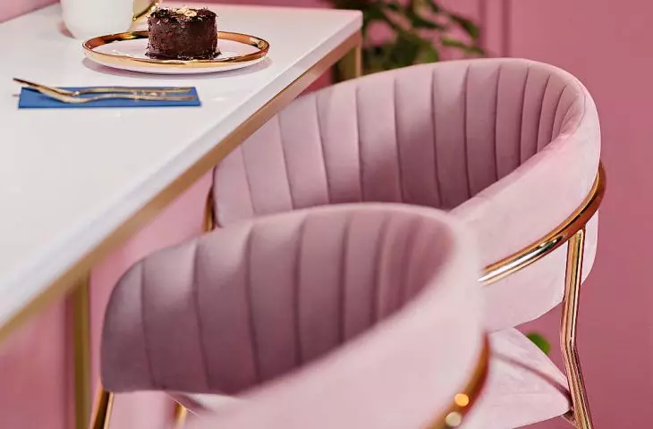a section with a long table and chairs for customers is the perfect backdrop for photos
