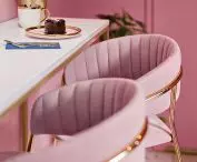 a section with a long table and chairs for customers is the perfect backdrop for photos