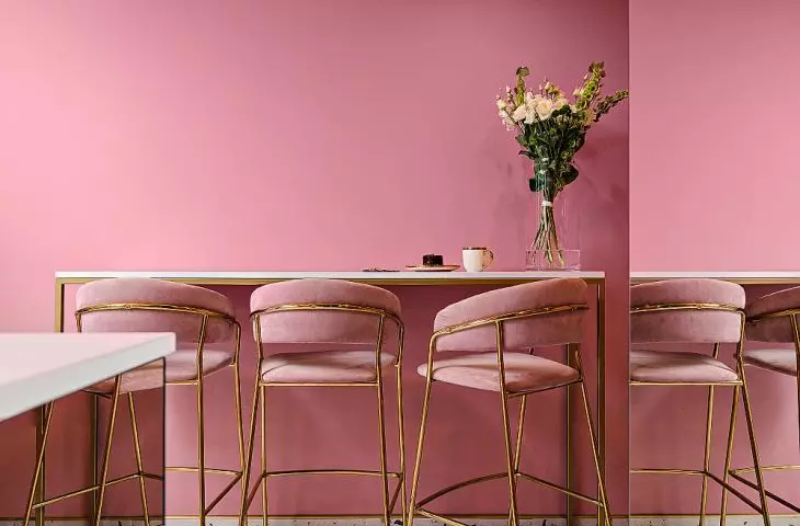 with pink and navy blue perfectly harmonizes with terrazzo patterned flooring