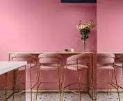 with pink and navy blue perfectly harmonizes with terrazzo patterned flooring