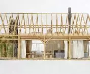 There is a kitchen and meeting space on the first floor and a greenhouse in the attic