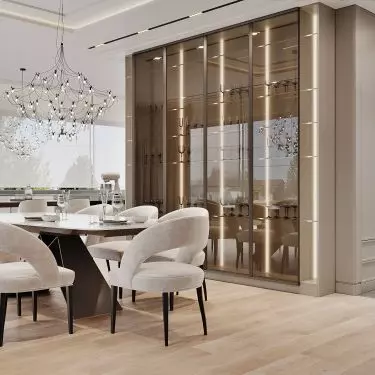 In the dining room you will find a glass display case in champagne colors