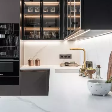  Gold faucet adds a touch of glamour to the styling