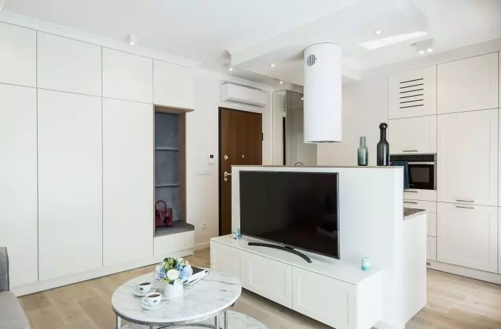 Living room and kitchen visible next door