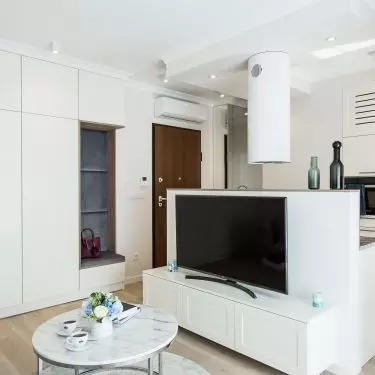 Living room and kitchen visible next door