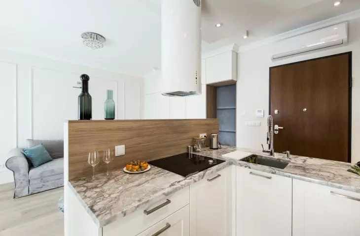 Kitchen and living room visible next door
