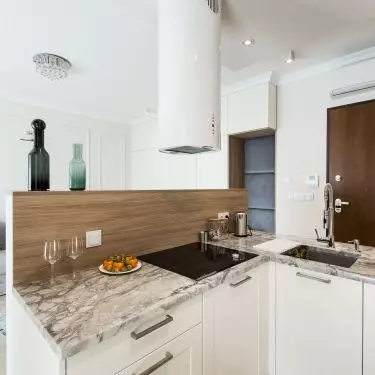 Kitchen and living room visible next door