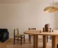 An oval table and an unusual lamp create the accent in the dining room
