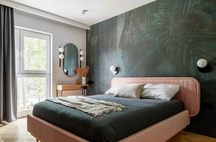 The bedroom is dominated by a large bed