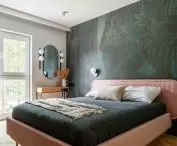 The bedroom is dominated by a large bed