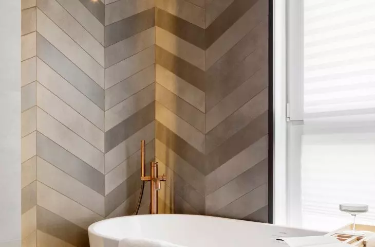 The walls are decorated with herringbone tiles