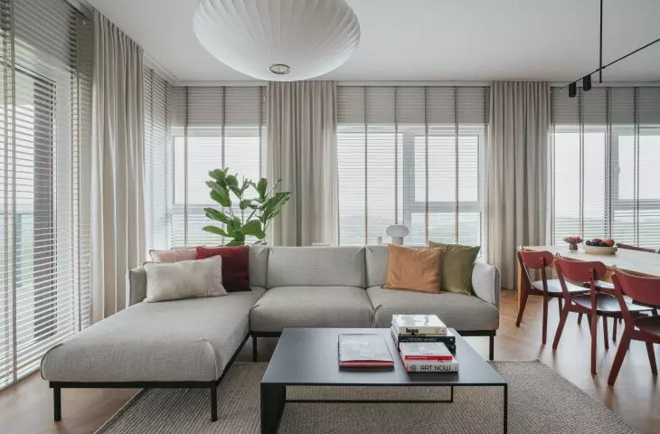 Bright living area with a large sofa bed
