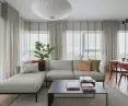 Bright living area with a large sofa bed