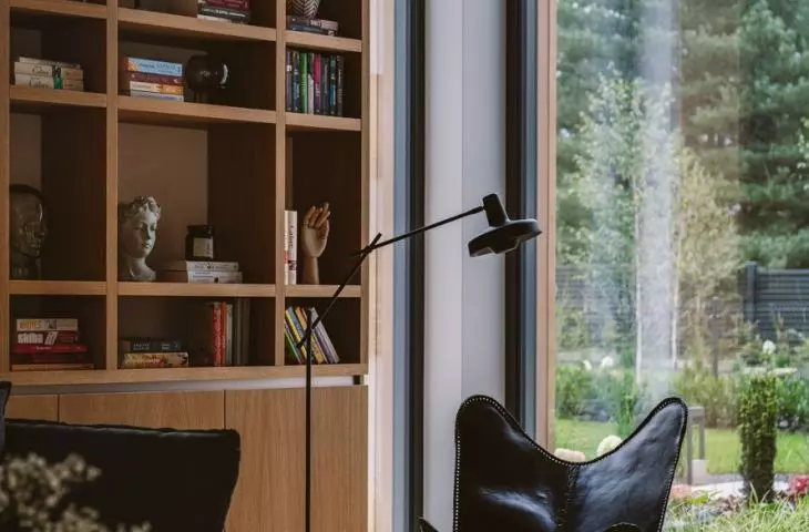 Fragment of the living room and with a wooden bookcase