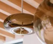 Strings of lamps in the living room resemble candle wicks