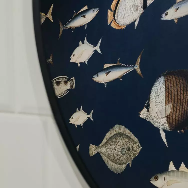 The highlight of the bathroom is the patterned wallpaper