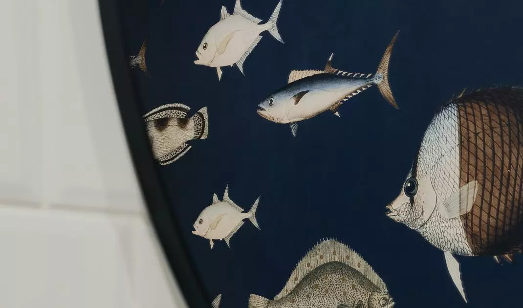 The highlight of the bathroom is the patterned wallpaper