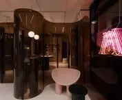 Transparent screen with a rounded form divides the space