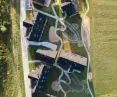 The first stage contains eight buildings connected by organic pathways