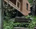 Wood and stone steps lead to the cottages