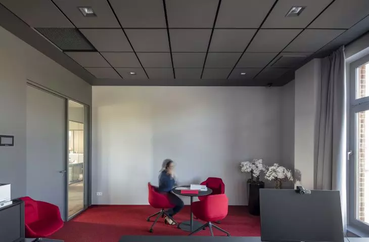 Ecophon Maste Eg ceiling system in a dark Silk Slate color was used in the offices of the Family Group company 