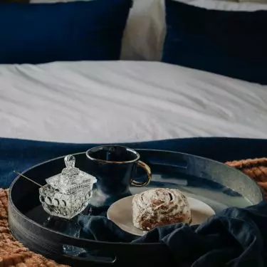 The bedroom is dominated by a combination of blue and red