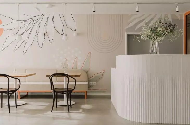 The interiors are in muted colors with terracotta accents