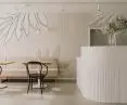 The interiors are in muted colors with terracotta accents