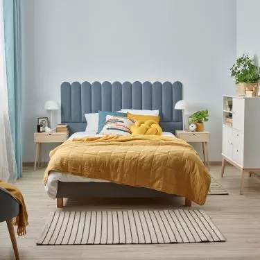 A cold wall? You can forget about it by using upholstered panels as a headrest